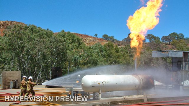 Flame Plume Above a Tank in a Training Yard