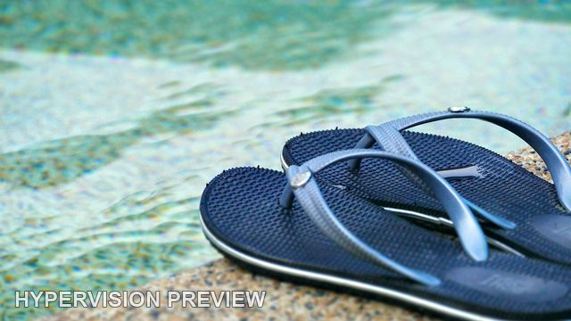 Blue Thongs at the Edge of Clear Pool Water