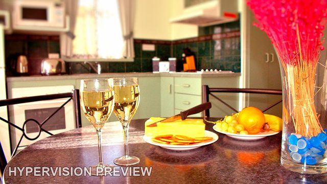 Wine Glasses and Fruit on a Kitchen Bench