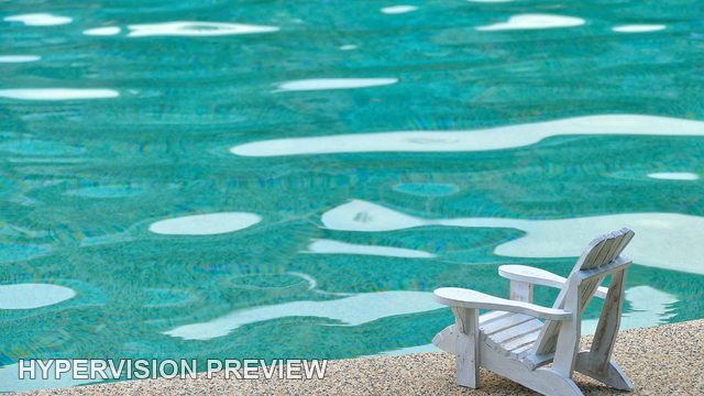 Small Poolside Chair Low in a Wide Water View