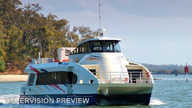 Passenger Ferry Passing a Bay Island Shore