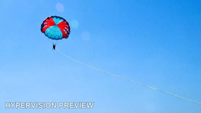 Small Parasail and Diagonal Tow Line in Open Sky