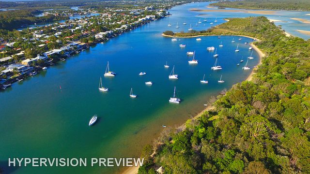 Yachts in Clear Green Anchorage Water