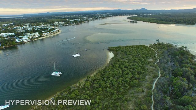 Wooded River Spit Beneath Evening Clouds