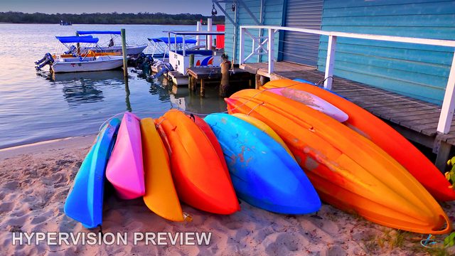 Kayaks Beside a Riverside Hire Shed