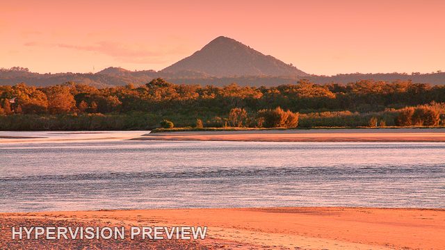 River Sandbank and Hill Beneath a Red Sky