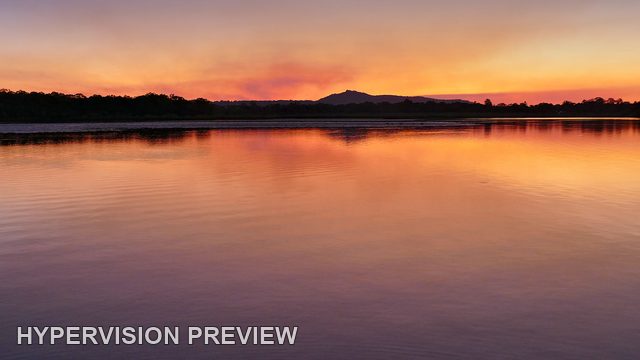 Orange Sunset Reflected Across a Calm River