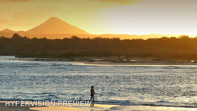 Lone Figure at the Golden Waterline