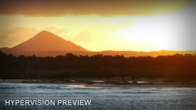 Hill and River Beneath a Vignetted Sunset