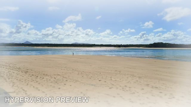 Quiet Beach Under Daytime Clouds