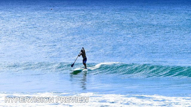 Stand-Up Paddleboarder on a Small Wave — Cool Blue