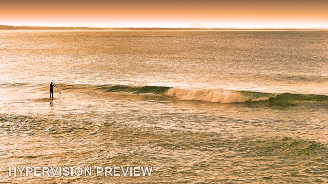 Distant Paddleboarder Across an Open Seascape — Warm Colour