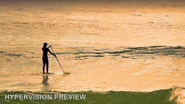 Paddleboard Silhouette on Shimmering Water — Warm Colour