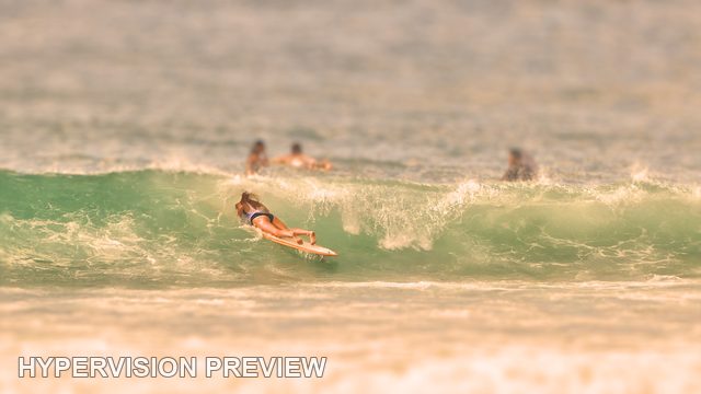 Surfer Crossing a Breaking Wave — Warm Muted Colour