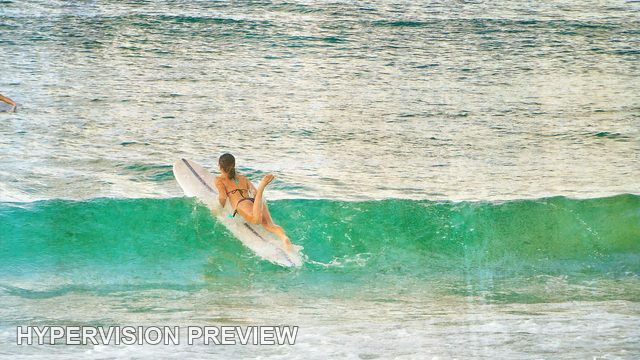 Surfer Paddling Over a Green Wave — Textured Colour