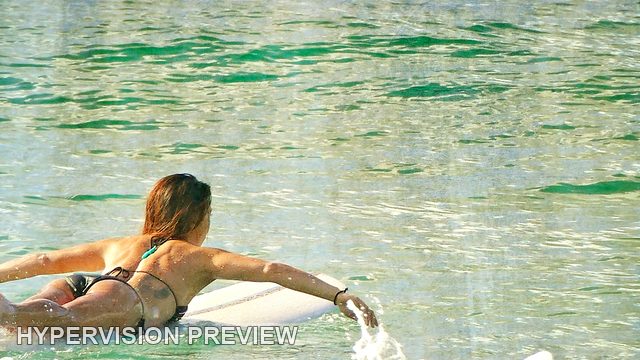 Surfer Paddling Across Clear Water — Textured Colour