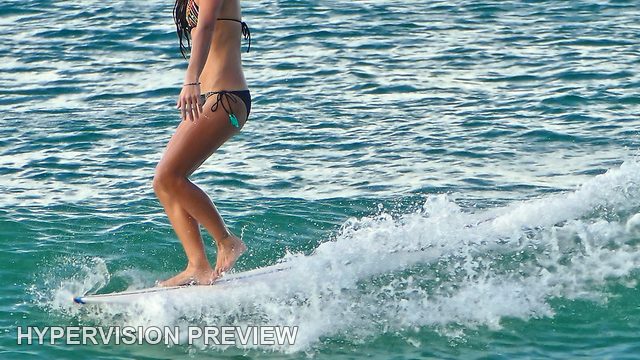Standing on a Board Along a Small Wave — Colour