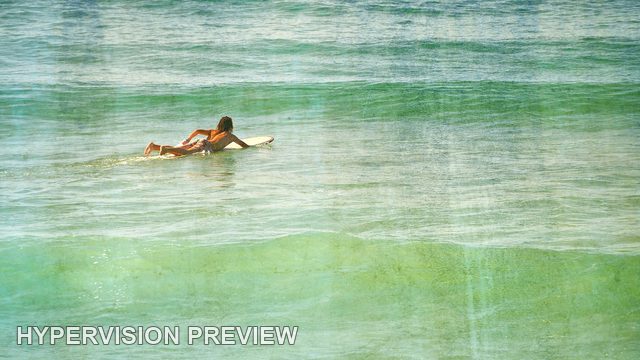 Surfer Paddling Towards an Incoming Swell — Warm Distressed Texture