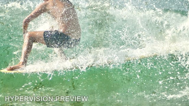 Crouching Surfer Surrounded by Spray — Fine Textured Colour