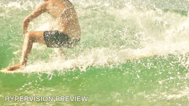 Crouching Surfer Surrounded by Spray — Warm Textured Colour
