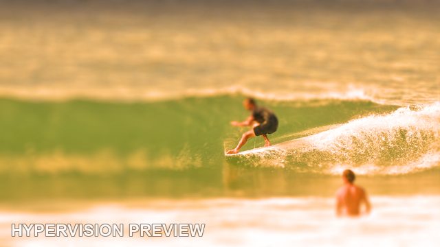 Surfer Riding a Steep Turquoise Wave — Warm Colour / Selective Focus 02