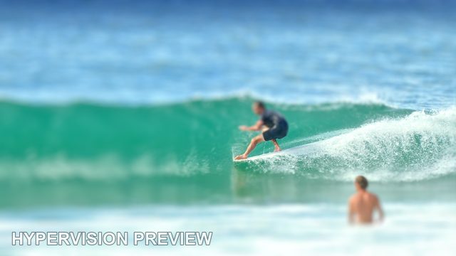 Surfer Riding a Steep Turquoise Wave — Selective Focus 02