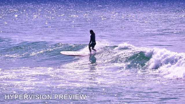 Silhouetted Longboarder on Sparkling Water — Purple