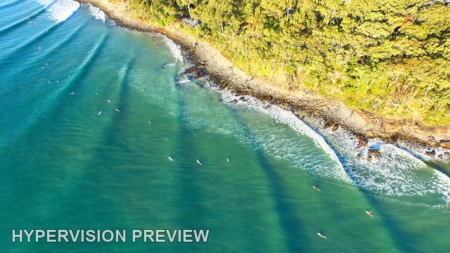 Overhead Surf Lines Along a Rocky Shore — Colour