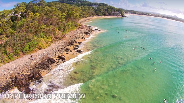Elevated View Along a Curving Surf Coast — Colour
