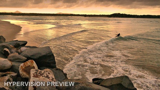 Lone Board Rider in Golden Shorebreak — Colour
