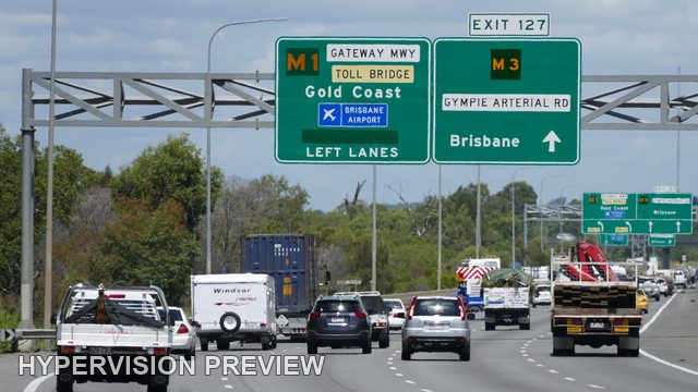 Mixed Traffic Approaching Exit 127 Direction Signs