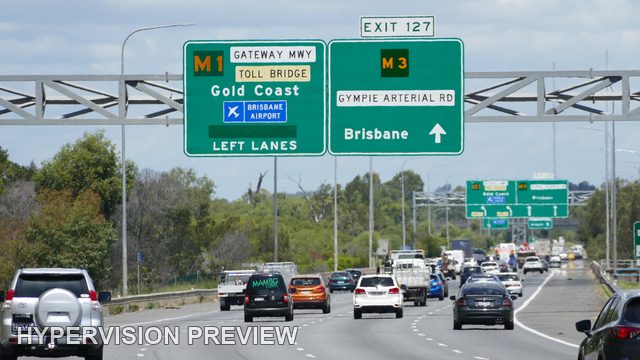Busy Motorway Lanes Beneath M1 and M3 Signs