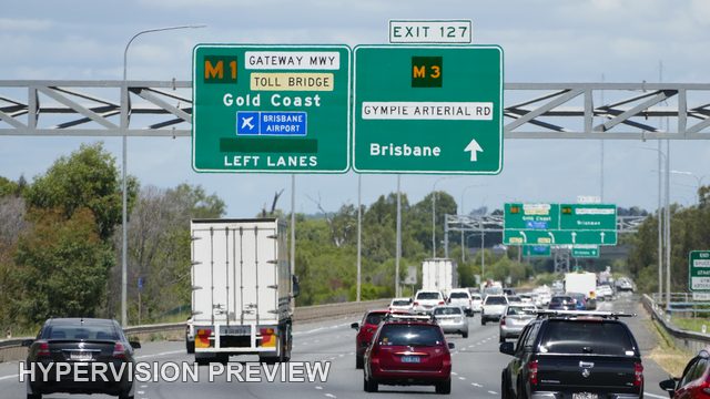 Box Truck Among Traffic Approaching the M1 and M3 Split