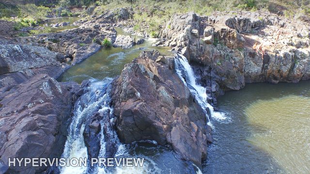 Aerial Close View of Water Dividing around Wappa Rocks