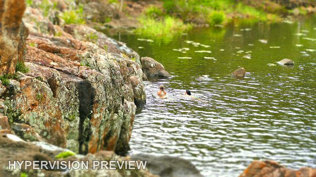 Two Swimmers beside the Rocks at Wappa Falls