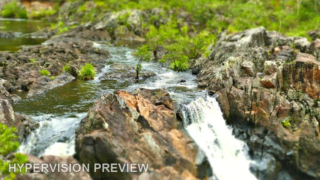 Wappa Cascades around a Central Rock in Soft Focus