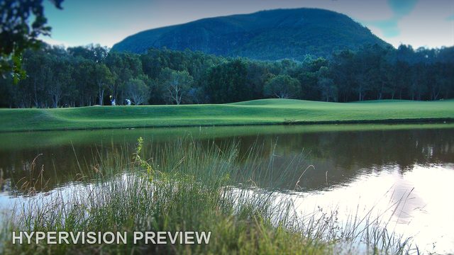 Mount Coolum Reflected beyond a Grassy Pond