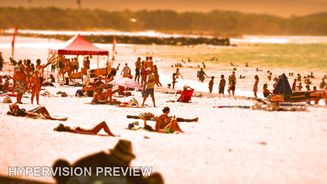 Beach Crowd Around a Red Shelter — Warm Edit, Selective Focus Edit