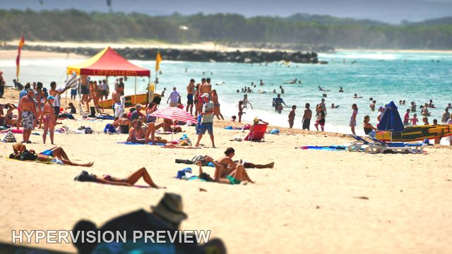 Beach Crowd Around a Red Shelter
