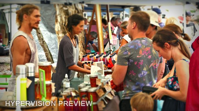 Shoppers at a Noosa Farmers Market Drinks Stall