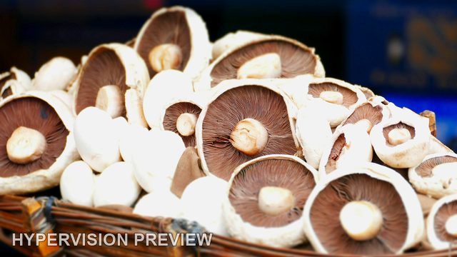 Open Mushroom Caps in a Wicker Basket
