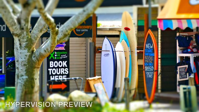 Surfboards Beside a Tour Booking Sign