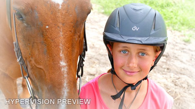 Young Rider Beside a Brown Horse