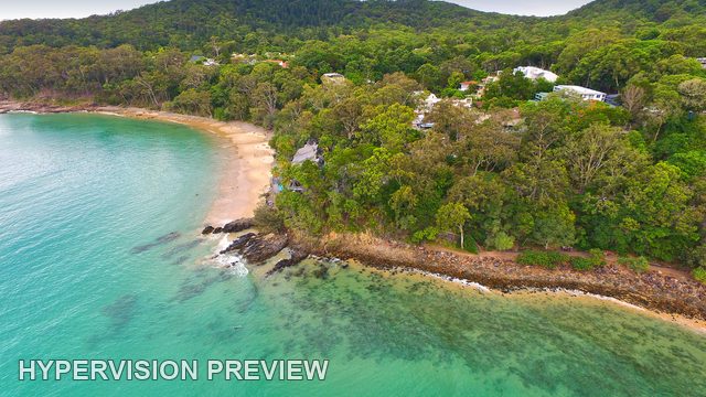 Rocky Shoreline and Wooded Slopes at Little Cove