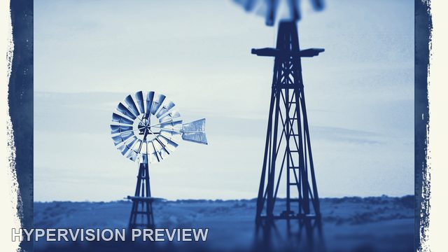 Two Windmills Above Rural Land in a Blue Vintage Frame