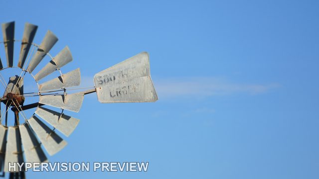 Windmill Rotor and Tail on the Left of Open Blue Sky