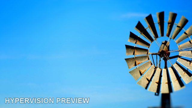 Windmill Rotor at the Right of Open Blue Sky