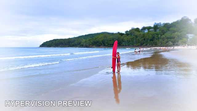 Young Surfer with an Upright Red Board at the Shore — White Vignette Edit