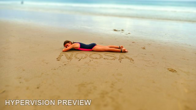 Child Resting Beside Noosa Writing in the Sand — Alternative Edit