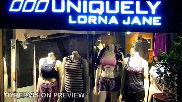 Illuminated Activewear Shop Window at Night